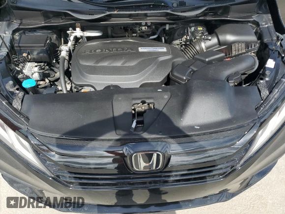 2018 Honda Odyssey EX-L z VIN 5FNRL6H7XJB031245, wystawiony jako Copart lot #59331635 z przebiegiem 74 901 mil mil oraz Czysty tytuł • Clean title. Historia ofert i sprzedaży dostępna na DreamBid. Obrazek 12.