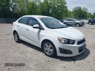 2014 Chevrolet Sonic LT z VIN 1G1JC5SH5E4187031, wystawiony jako IAAI lot #42305662 z przebiegiem 94 873 mil mil oraz . Historia ofert i sprzedaży dostępna na DreamBid. Obrazek 1.