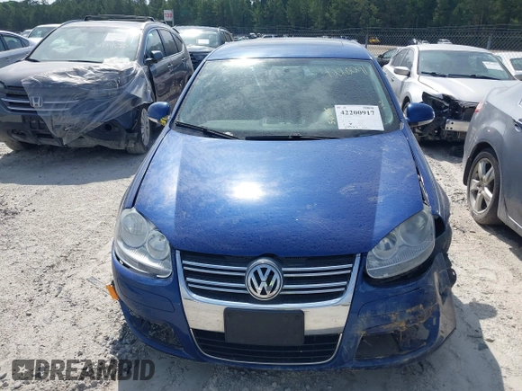 2009 Volkswagen Jetta SE z VIN 3VWRZ71K99M159242, wystawiony jako IAAI lot #42200917 z przebiegiem 226 285 mil mil oraz . Historia ofert i sprzedaży dostępna na DreamBid. Obrazek 13.