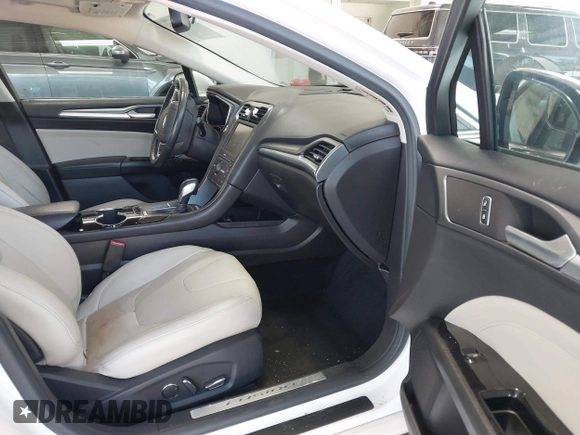 2016 Ford Fusion Titanium with VIN 3FA6P0K96GR390989, listed as a IAAI auction lot 42634275 with 123,559 mi miles and . Bid and sale history available at DreamBid. Image 5.