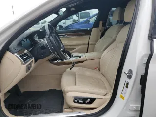 2016 BMW 7 Series 740i with VIN WBA7E2C52GG547112, listed as a Copart auction lot 63069355 with 76,867 mi miles and Salvage title. Bid and sale history available at DreamBid. Image 7.
