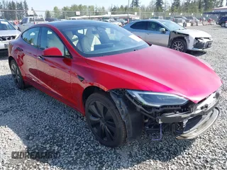 2023 Tesla Model S with VIN 5YJSA1E5XPF516779, listed as a IAAI auction lot 42110737 with 16,465 mi miles and . Bid and sale history available at DreamBid. Image 1.