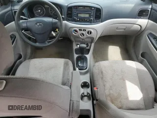 2006 Hyundai Accent GLS with VIN KMHCN46C46U048752, listed as a Copart auction lot 52930035 with 143,688 mi miles and Salvage title. Bid and sale history available at DreamBid. Image 8.