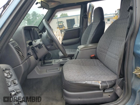 1999 Jeep Cherokee Sport с VIN 1J4FT68S9XL552299, выставлен на аукционе Copart как лот 58045135 с пробегом Не указан миль и Списание • Salvage title. История ставок и продаж доступна на DreamBid. Изображение 7.