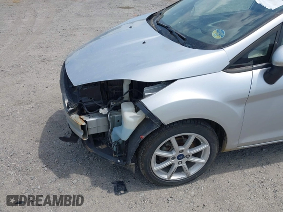 2019 Ford Fiesta SE z VIN 3FADP4EJ9KM107124, wystawiony jako IAAI lot #42067464 z przebiegiem 89 076 mil mil oraz . Historia ofert i sprzedaży dostępna na DreamBid. Obrazek 18.