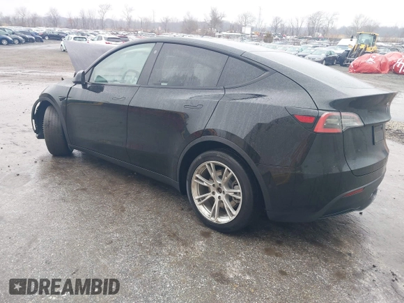 2021 Tesla Model Y Standard Range with VIN 5YJYGDED9MF103989, listed as a IAAI auction lot 41482268 with 33,485 mi miles and . Bid and sale history available at DreamBid. Image 3.