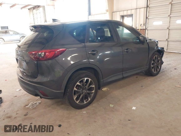 2016 Mazda CX-5 Grand Touring with VIN JM3KE2DYXG0846787, listed as a IAAI auction lot 41346364 with 113,553 mi miles. Bid and sale history available at carsss.com. Image 4.