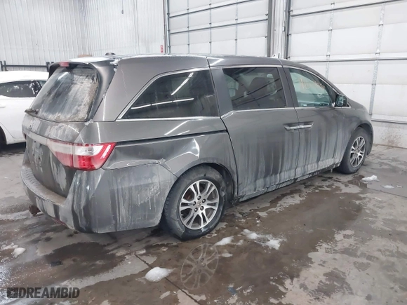 2012 Honda Odyssey EX-L with VIN 5FNRL5H66CB101151, listed as a IAAI auction lot 41504250 with 261,836 mi miles. Bid and sale history available at carsss.com. Image 4.