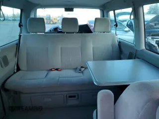 2003 Volkswagen EuroVan MV с VIN WV2MB47053H002505, выставлен на аукционе Copart как лот 83840884 с пробегом 250 786 миль миль и Чистый • Clean title. История ставок и продаж доступна на DreamBid. Изображение 10.