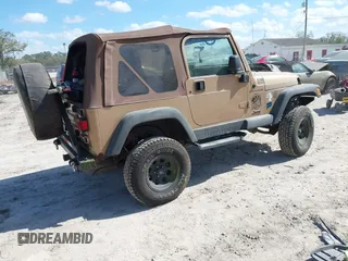 2000 Jeep Wrangler Sahara with VIN 1J4FA59S8YP763468, listed as a IAAI auction lot 41554183 with 182,922 mi miles. Bid and sale history available at carsss.com. Image 4.