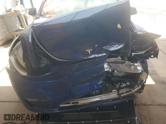 2023 Tesla Model Y Long Range with VIN 7SAYGDEE7PA112865, listed as a Copart auction lot 54626685 with 10,720 mi miles and Salvage Title. Bid and sale history available at DreamBid. Image 11.