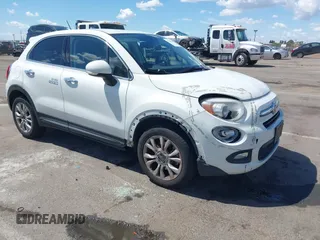 2016 FIAT 500X Lounge z VIN ZFBCFXDT0GP333273, wystawiony jako IAAI lot #42269130 z przebiegiem 98 707 mil mil oraz . Historia ofert i sprzedaży dostępna na DreamBid. Obrazek 1.