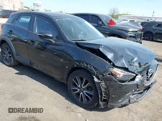 2018 Mazda CX-3 Touring z VIN JM1DKDC70J0329410, wystawiony jako IAAI lot #42137391 z przebiegiem 86 013 mil mil oraz . Historia ofert i sprzedaży dostępna na DreamBid. Obrazek 1.