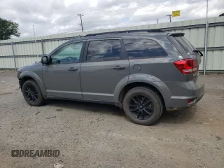 2019 Dodge Journey SE with VIN 3C4PDCBB0KT875474, listed as a Copart auction lot 52987395 with 76,816 mi miles and Salvage Title. Bid and sale history available at DreamBid. Image 2.