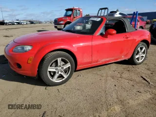 2006 Mazda MX-5 Miata Touring z VIN JM1NC25F360110572, wystawiony jako Copart lot #50555765 z przebiegiem 166 785 mil mil oraz Czysty tytuł • Clean title. Historia ofert i sprzedaży dostępna na DreamBid. Obrazek 1.