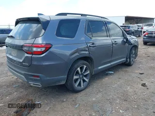 2024 Honda Pilot Touring with VIN 5FNYG2H7XRB014420, listed as a IAAI auction lot 41919635 with Not provided miles and . Bid and sale history available at DreamBid. Image 4.