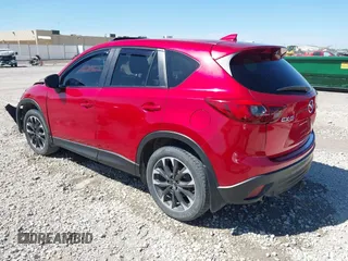 2016 Mazda CX-5 Grand Touring with VIN JM3KE2DYXG0652017, listed as a IAAI auction lot 42041158 with 95,946 mi miles and . Bid and sale history available at DreamBid. Image 3.