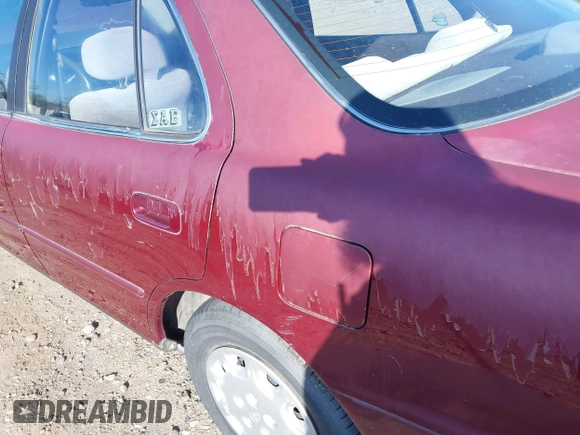 1996 Toyota Camry DX with VIN JT2BG12K4T0363844, listed as a IAAI auction lot 42215996 with 214,452 mi miles and . Bid and sale history available at DreamBid. Image 14.