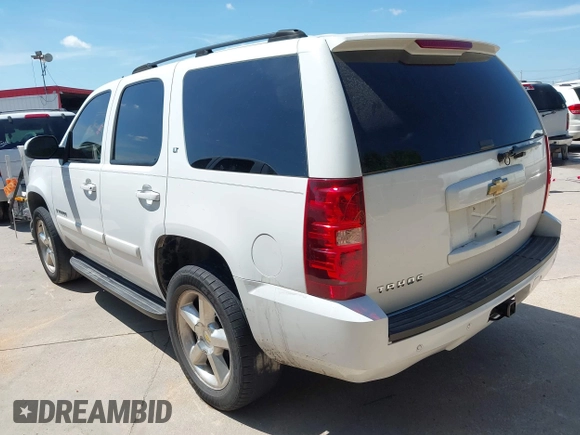 2007 Chevrolet Tahoe LS with VIN 1GNFC13007R310861, listed as a IAAI auction lot 42621401 with 241,291 mi miles and . Bid and sale history available at DreamBid. Image 3.