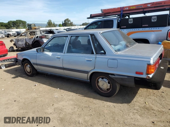 1986 Toyota Camry z VIN JT2SV12E3G6021210, wystawiony jako Copart lot #49623985 z przebiegiem 144 064 mil mil oraz Czysty tytuł • Clean title. Historia ofert i sprzedaży dostępna na DreamBid. Obrazek 2.