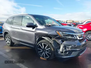 2019 Honda Pilot Touring 7-Passenger z VIN 5FNYF5H65KB020420, wystawiony jako IAAI lot #41575972 z przebiegiem 48 950 mil mil oraz . Historia ofert i sprzedaży dostępna na DreamBid. Obrazek 6.
