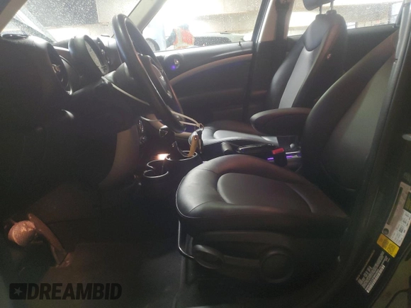 2015 MINI Countryman with VIN WMWZB3C53FWR43903, listed as a Copart auction lot 86384294 with 112,667 mi miles and Salvage Title. Bid and sale history available at DreamBid. Image 7.