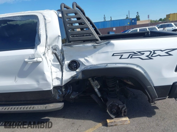 2021 Ram 1500 TRX with VIN 1C6SRFU9XMN905260, listed as a IAAI auction lot 41745910 with 69,565 mi miles and . Bid and sale history available at DreamBid. Image 6.
