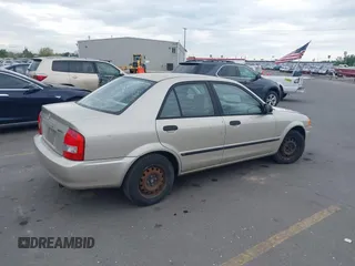 2000 Mazda Protege DX with VIN JM1BJ2227Y0237323, listed as a IAAI auction lot 42179683 with Not Provided miles and . Bid and sale history available at DreamBid. Image 4.