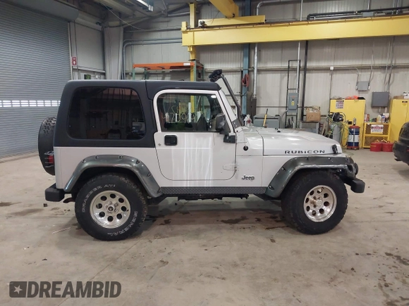 2003 Jeep Wrangler Rubicon with VIN 1J4FA69S13P375142, listed as a IAAI auction lot 41709647 with 125,443 mi miles and . Bid and sale history available at DreamBid. Image 14.