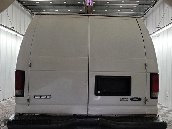 2010 Ford Econoline Cargo Commercial with VIN 1FTNE1EW4ADA91052, listed as a IAAI auction lot 42607935 with 163,519 mi miles and . Bid and sale history available at DreamBid. Image 54.