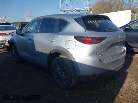 2020 Mazda CX-5 Touring with VIN JM3KFACM5L0766698, listed as a IAAI auction lot 42006157 with 80,288 mi miles and . Bid and sale history available at carsss.com. Image 3.