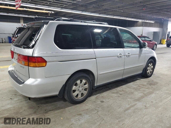 2002 Honda Odyssey EX with VIN 2HKRL18642H578718, listed as a Copart auction lot 59052525 with 170,928 mi miles and Salvage title. Bid and sale history available at DreamBid. Image 3.