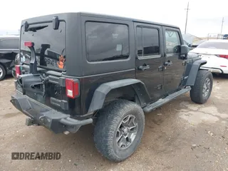2012 Jeep Wrangler Unlimited Rubicon with VIN 1C4HJWFGXCL142804, listed as a IAAI auction lot 42183960 with 124,392 mi miles and . Bid and sale history available at DreamBid. Image 4.