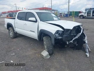 2020 Toyota Tacoma SR5 with VIN 3TMCZ5AN1LM334890, listed as a IAAI auction lot 41991351 with 73,445 mi miles and . Bid and sale history available at DreamBid. Image 1.