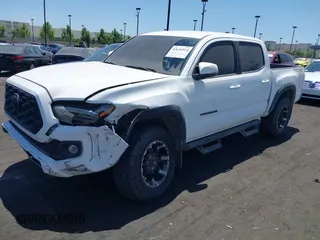 2023 Toyota Tacoma SR with VIN 3TMCZ5AN4PM558760, listed as a IAAI auction lot 42626514 with 39,335 mi miles and . Bid and sale history available at DreamBid. Image 6.