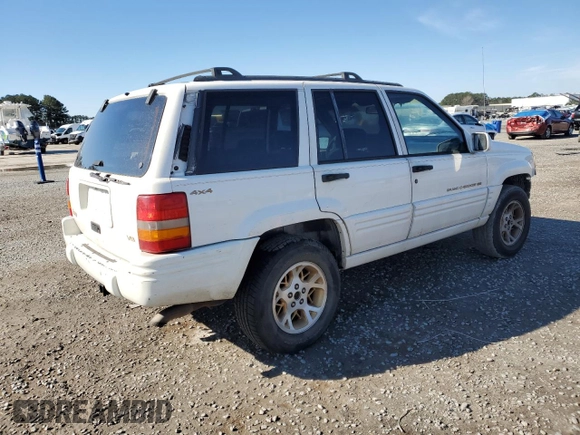 1998 Jeep Grand Cherokee Limited with VIN 1J4GZ78Y0WC307578, listed as a Copart auction lot 45272765 with 328,264 mi miles and Salvage title. Bid and sale history available at DreamBid. Image 3.