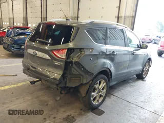2016 Ford Escape Titanium with VIN 1FMCU9J92GUB63525, listed as a IAAI auction lot 41469824 with 156,773 mi miles. Bid and sale history available at carsss.com. Image 4.
