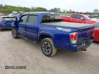2023 Toyota Tacoma SR z VIN 3TMCZ5AN1PM589061, wystawiony jako IAAI lot #41936717 z przebiegiem 41 395 mil mil oraz . Historia ofert i sprzedaży dostępna na DreamBid. Obrazek 3.