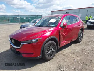2021 Mazda CX-5 Touring z VIN JM3KFBCM1M0401717, wystawiony jako IAAI lot #42036407 z przebiegiem 35 587 mil mil oraz . Historia ofert i sprzedaży dostępna na DreamBid. Obrazek 2.