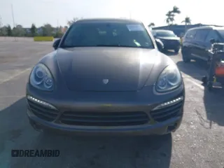 2011 Porsche Cayenne S Hybrid with VIN WP1AE2A29BLA94414, listed as a IAAI auction lot 41644386 with 76,095 mi miles. Bid and sale history available at carsss.com. Image 12.