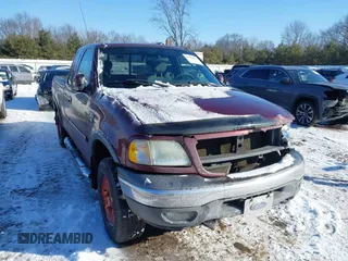 2003 Ford F-150 XL with VIN 1FTRX18L33NB00026, listed as a IAAI auction lot 41608554 with 161,877 mi miles. Bid and sale history available at carsss.com. Image 1.