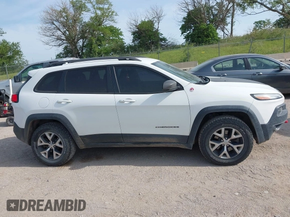 2015 Jeep Cherokee Trailhawk with VIN 1C4PJMBS6FW687718, listed as a IAAI auction lot 42505169 with 122,526 mi miles and . Bid and sale history available at DreamBid. Image 14.