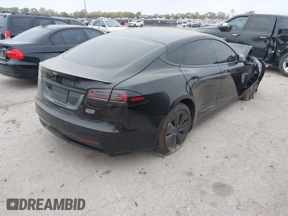2022 Tesla Model S Plaid with VIN 5YJSA1E65NF484149, listed as a IAAI auction lot 40937538 with 11,459 mi miles and . Bid and sale history available at DreamBid. Image 4.