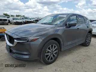 2018 Mazda CX-5 Grand Touring z VIN JM3KFADM2J1339937, wystawiony jako Copart lot #55747915 z przebiegiem 130 428 mil mil oraz Szkoda całkowita • Salvage title. Historia ofert i sprzedaży dostępna na DreamBid. Obrazek 1.