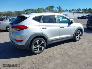2016 Hyundai Tucson Sport with VIN KM8J33A25GU224084, listed as a IAAI auction lot 41827851 with 153,348 mi miles. Bid and sale history available at carsss.com. Image 4.