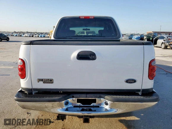 2002 Ford F-150 XLT with VIN 1FTRW08692KD89789, listed as a Copart auction lot 52621555 with 150,012 mi miles and Salvage Title. Bid and sale history available at carsss.com. Image 6.