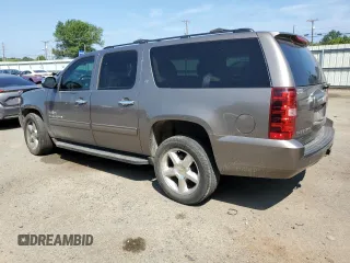 2013 Chevrolet Suburban LT with VIN 1GNSCJE07DR104489, listed as a Copart auction lot 60844784 with 185,420 mi miles and Salvage Title. Bid and sale history available at carsss.com. Image 2.