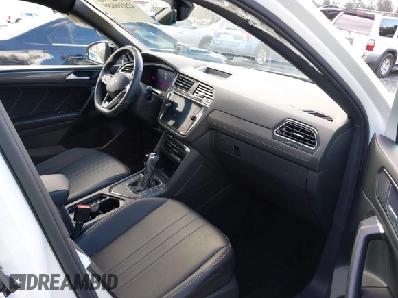 2023 Volkswagen Tiguan SE R-Line Black with VIN 3VVCB7AX3PM014446, listed as a IAAI auction lot 42016885 with 12,726 mi miles and . Bid and sale history available at DreamBid. Image 5.