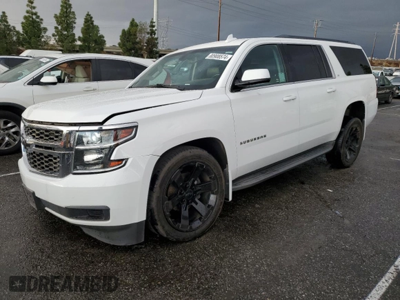 2015 Chevrolet Suburban LS with VIN 1GNSCHKC9FR667540, listed as a Copart auction lot 80908574 with 125,428 mi miles and Salvage title. Bid and sale history available at DreamBid. Image 1.