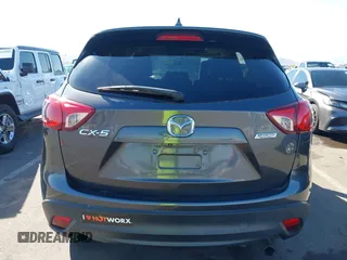 2016 Mazda CX-5 Grand Touring z VIN JM3KE2DYXG0649781, wystawiony jako IAAI lot #41636329 z przebiegiem 83 433 mil mil oraz . Historia ofert i sprzedaży dostępna na DreamBid. Obrazek 16.